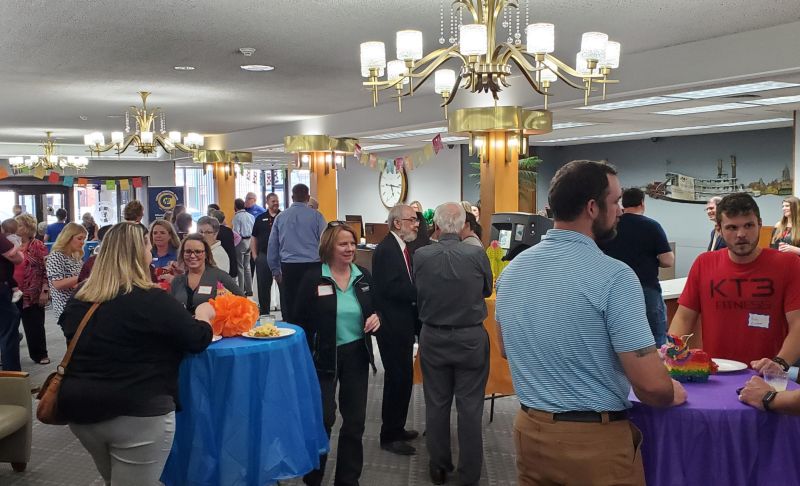 Image of people mingling and networking at an event in Clinton, Iowa