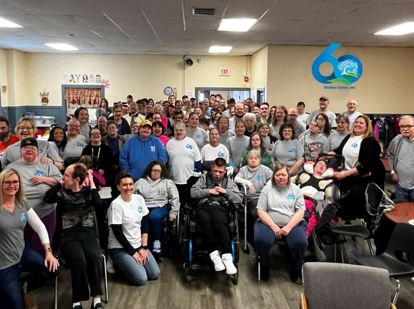 Group of people standing in a group for picture for Clinton, IA non-profit