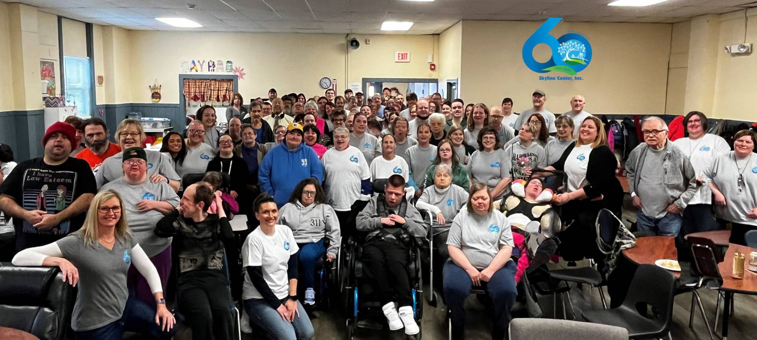 Group of people standing in a group for picture for Clinton, IA non-profit